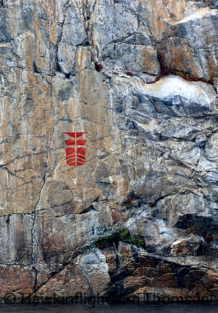 Tribal marking on sea cliff